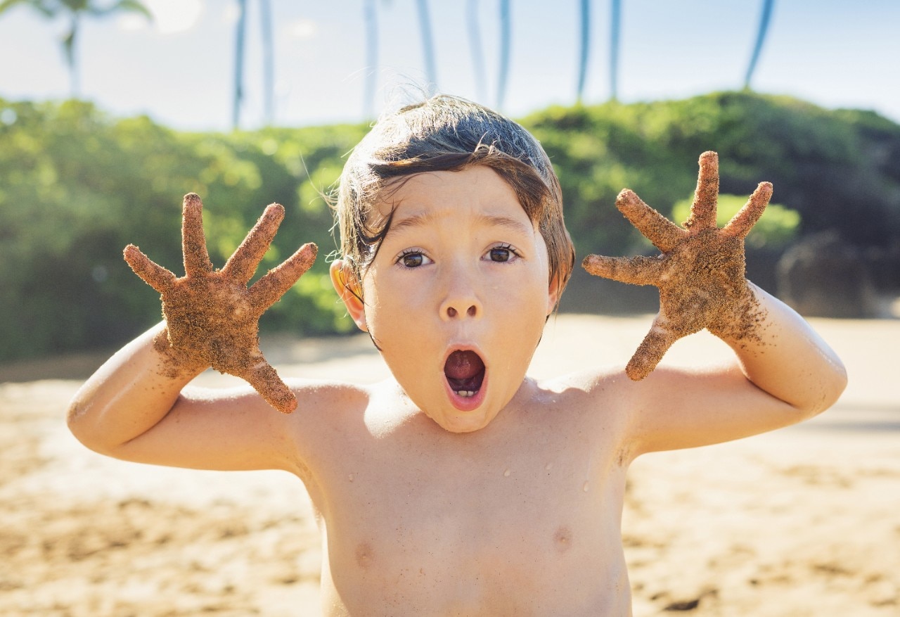 Happy young boy at the beach