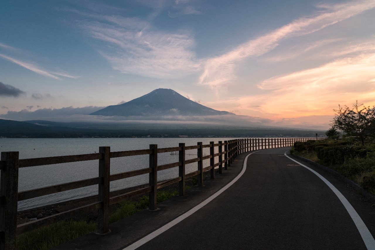 Lake Yamanaka, Yamanakako Village, Yamanashi Prefecture, Japan - July 11, 2017: Lake Yamanaka is one of the five lakes in the northern Fuji area. The lake is a popular tourist destination and considered as one of the best places to admire the beauty of Fuji. Many people come to the lake to avoid heat in summer and see Diamond Fuji in winter.