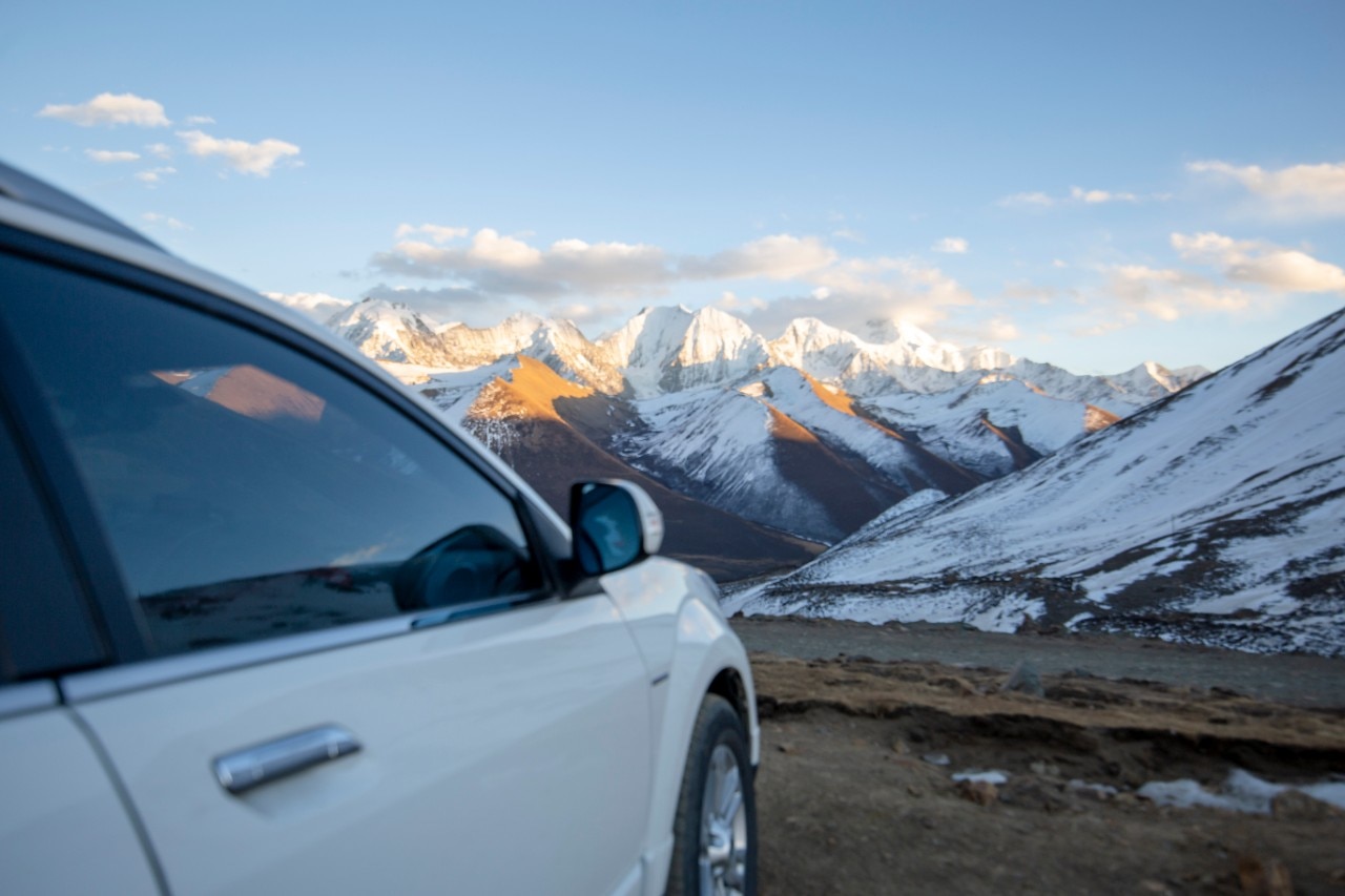 Snowy mountains at dusk on the plateau in winter